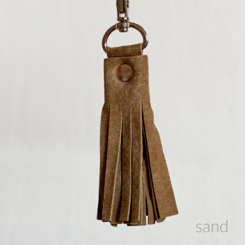 Quaste, sand